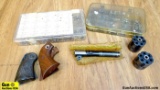 Ruger, Colt Gun Parts. Assortment of Screws, 2 Revolver Cylinders, 2 Sets of Revolver Grips, One 191