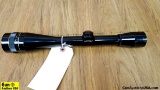 Leupold Scope. Very Good. Glossy Black, Objective Lens, Seems to be 10 or 12 Power. . (52586)