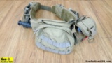 Combat Belt/with Multiple Accessories. Very Good. Desert Tan Combat Belt with Accessories. Includes