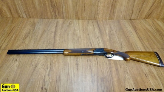 Browning 20 ga. Over- Under Shotgun. Very Good.  28" Barrel. Shiny Bore, Tight Action Features a  Gl