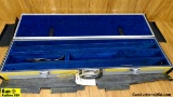 Gun Case. Good Condition. Aluminum, Blue Velvet Lined, Shotgun Case. Lockable. Includes Nylon Cover.