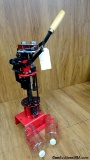 MPC 8567 GRABBER Re-Loading Press. . Very Good. Reloading Turret Press. Includes Two Bottles. . (629
