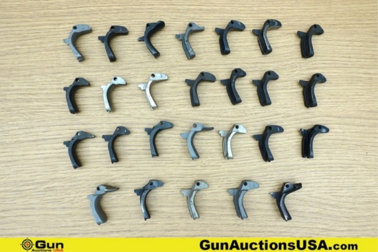1911 Gun Parts. Good Condition. Twenty-Six Assorted 1911 Backstrap Safeties.. (76637) (GSCM59)