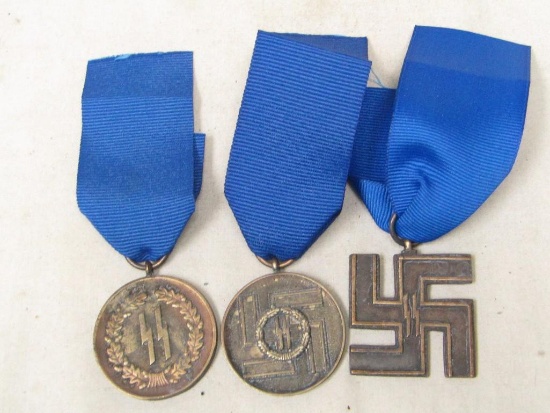Group of THREE German WWII Third Reich period SS Long Service awards. 4 8 12 years.