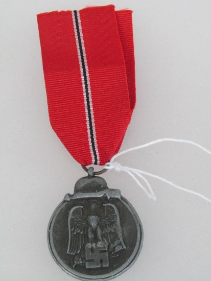 German World War II 1941/42 Eastern Front Decoration. Includes the issue ribbon.