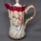 Fold over handle chocolate pot w/ red trim Hand painted florals