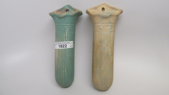 Pair of art pottery wall pockets