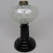 #1 stand lamp in Eason pattern with white opal font black stem and base. Co