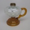 #1 footed finger lamp in Angela pattern with white opal Coin Spot font with