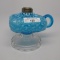 #1 footed finger lamp in Snow Flake pattern with blue opal and font clear h