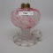 #1 footed finger lamp in Sheldon Swirl pattern with cranberry spatter font