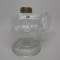 #1 footed finger lamp in King Melon pattern with white opal Coin Spot font