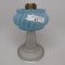 #1 stand lamp with white opal vertical stripes in blue font with frosted st