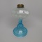 #1 stand lamp  with white opal Coin Spot in clear font, blue stem and base