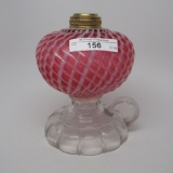 #1 footed finger lamp in Sheldon Swirl pattern with opal cranberry font cle