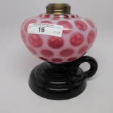 #1 footed finger lamp in Eaon pattern with opal cranberry font and black ha