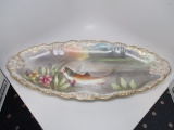 Limoge 12 piece games set w/ hand painted fish. Artist signed , 2 plates ha