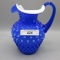 Fenton blue cased hobnail syrup pitcher