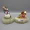 Clown staues on marble bases 