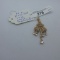 14K Rose Gold w/ White Sapphires? Pendant Stones appear to be white sapphir