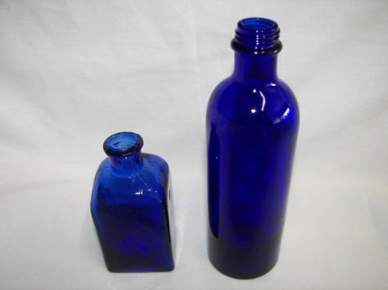 2 SMALL BLUE GLASS DECORATIVE BOTTLES