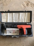 Powder actuated tool