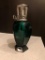 Lampe Berger Glass green fragrance bottle.