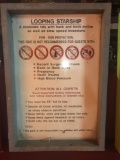 Looping Starship ride instructional safety sign