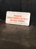Please Hold Onto Lapbar Sign