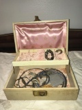 Vintage jewelry box with contents