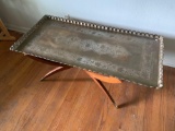 Sold brass tray-style coffee table with base