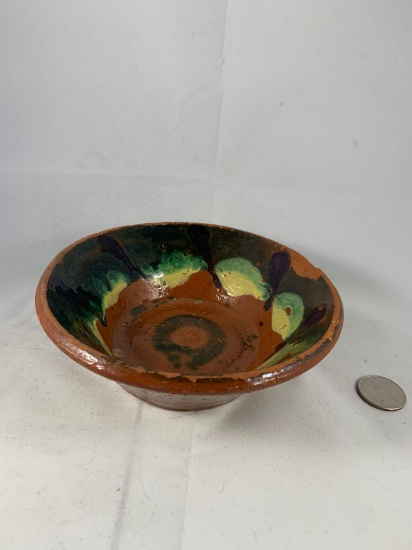 Handmade and handpainted pottery piece