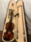 Violin in case with bows