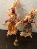 Decorative scarecrows and bell