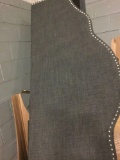 Headboard with decorative nail trim in dark gray fabric