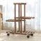 YOUFANG Wooden Plant Stand Shelf 4 Tier High Low Shelves with Wheels Flower Rack Display