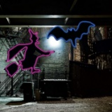 Halloween Haunters Purple Light-Up Sign Hanging Wicked Witch and Vampire Bat Silhouette Set Prop