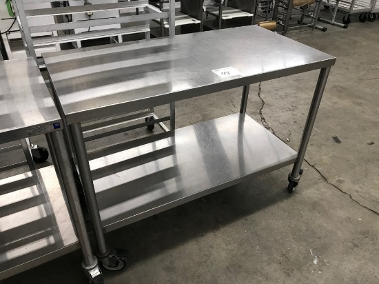 4' Stainless table on casters and shelf