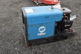 MILLER STICK/TIG/WIRE WELDER, 2,054 HRS, USES OIL (WORKS GOOD FOR WIRE & TIG, NEEDS NEW VOLTAGE REGU