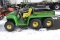 JD 6X4 gator w/ Deisel, manual dumping bed, 1,484 hrs.