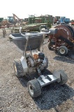 Gound Logic ride on seed/fertilizer spreader powered by gas engine