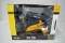 Prestige Collection JD 323D skidsteer, die-cast metal, 1/16 scale, new in box