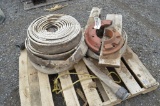 Pallet of water hose & tractor weights