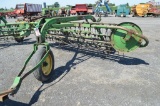 JD 673 roll-a-bar rake w/ dolly wheel, right discharge