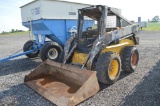 NH LS180 skid loader w/ 6634hrs, aux hyd, manual quick att, foot controls, sells w/ 66'' material bu