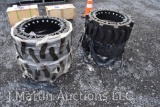 4- Evolution 12x16.5 solid tires on 8 bolt rims (x4)