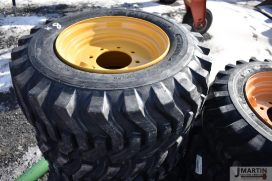 4- 12-16.5 skid loader tires on Cat Rims