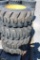 4- Forerunner 12-16.5 skid loader tires w/ cat rims (x4)