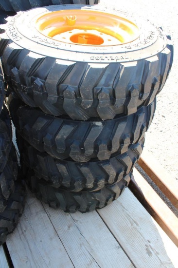 4- Forerunner 10-16.5 skid loader tires w/ case rims (x4)