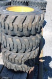 4- Forerunner 12-16.5 skid loader tires w/ cat rims (x4)
